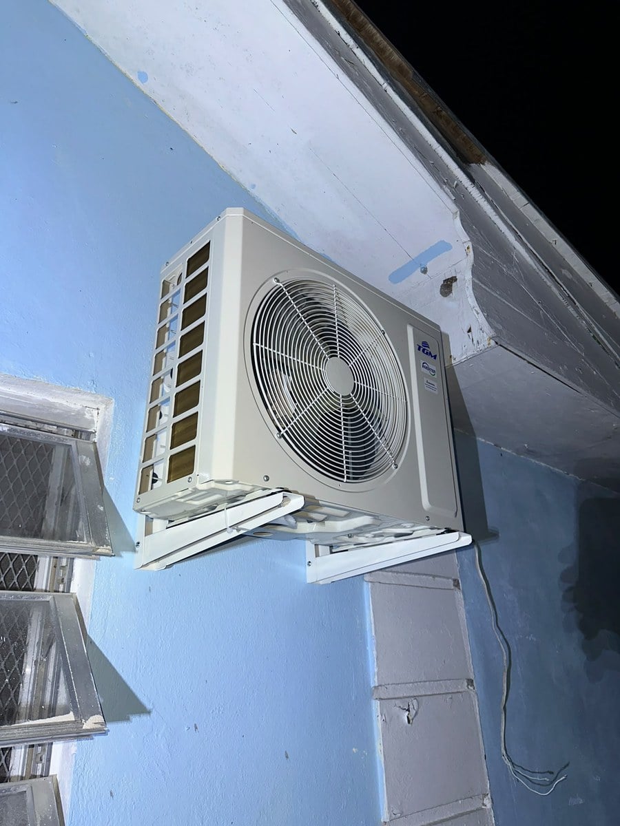 Condenser unit installed and running at night