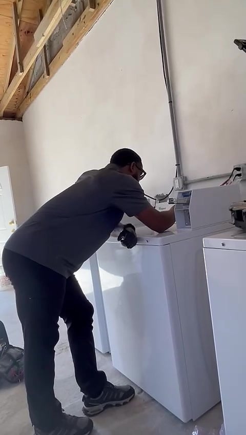 Servicing a domestic washing machine